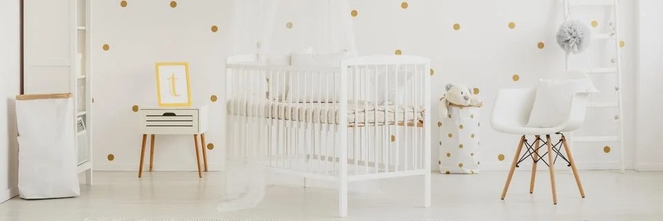 Tulle canopy over baby crib Stock Photos