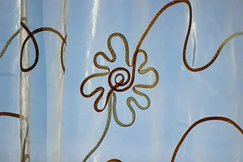 Tulle with a floral pattern on a blue background Foto stock