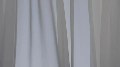 Tulle hanging on window moves from wind blow in room Stock Footage 242846535