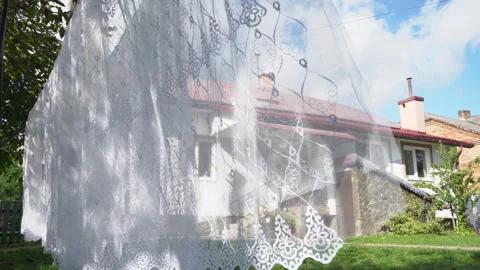 Tulle hangs in the yard on a string Stock Footage 256891479