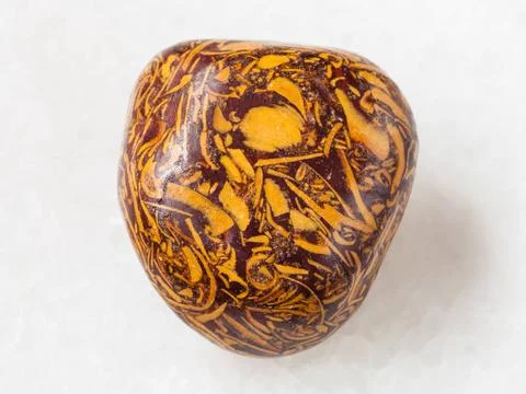 Tumbled Script stone gemstone on white macro shooting of natural mineral r... Foto stock