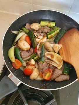 Tumis Daging Sapi Mercon or Stir fry or sauteed of beef with onion, red cay.. Stock Photos