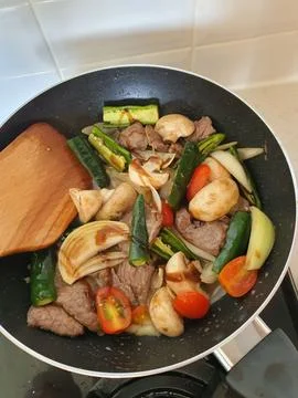 Tumis Daging Sapi Mercon or Stir fry or sauteed of beef with onion, red cay.. Stock Photos