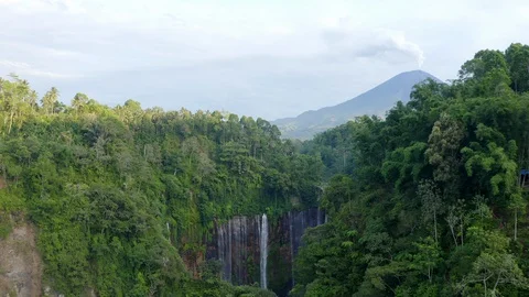 Tumpak Sewu waterfall hidden in East Java jungle, erupting volcano in Stock Footage 129288412