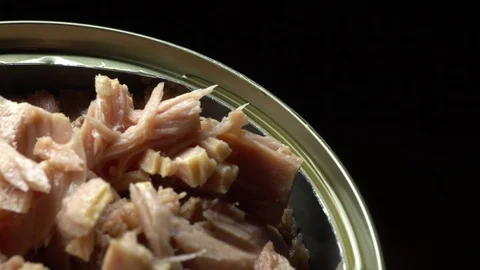 Tuna flakes opened can top close up Video stock 82699906
