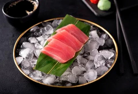 Tuna sashimi on ice in a black plate Stock Photos