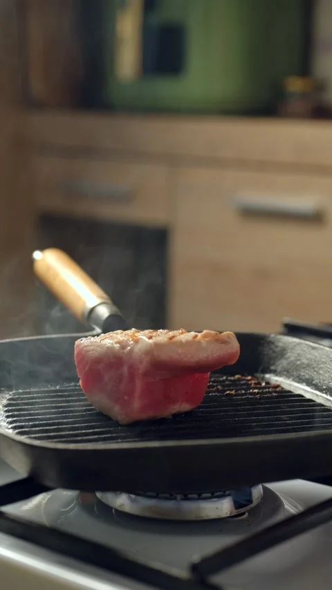 Tuna steak in griddle pan Stock Footage 342388853