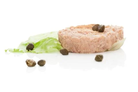 Tuna steak with lettuce salad isolated on white. Stock Photos