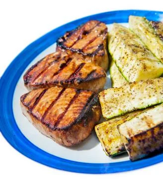 Tuna with vegetables on a plate Stock Photos