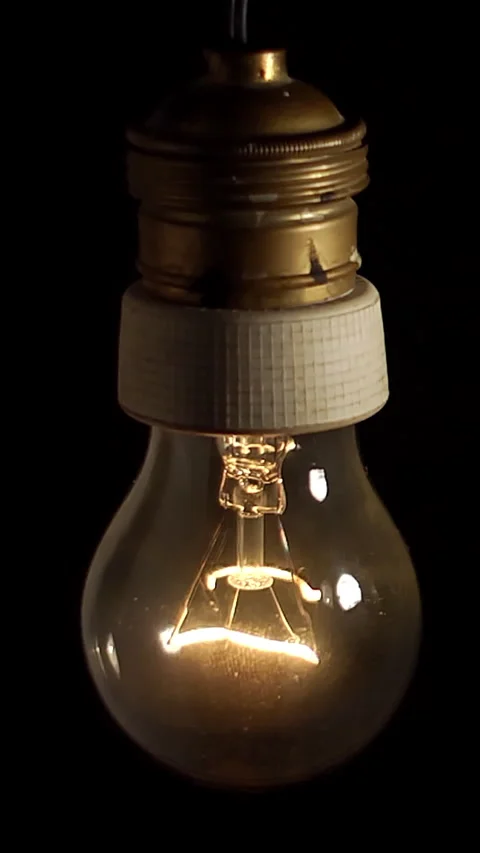 Tungsten Bulb Glowing Slowly in the Dark Stock Footage 308366331