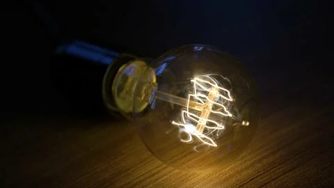 A tungsten lamp lights up Stock Footage 226203535