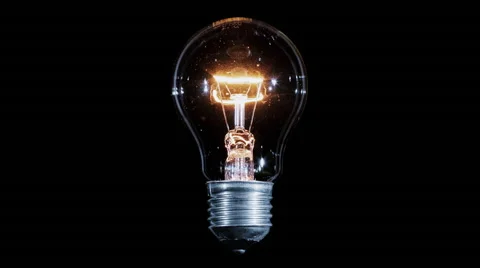 Tungsten light bulb lamp blinking over black background, loop Video stock 64073101
