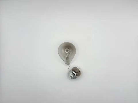 Tungsten light bulb lamp. Non-working light bulb, broken light bulb. Concept of Stock Photos