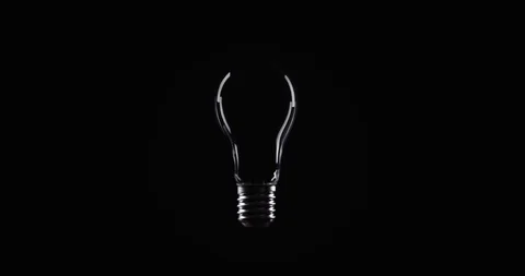 Tungsten light bulb lamp over black background Video stock 101945759