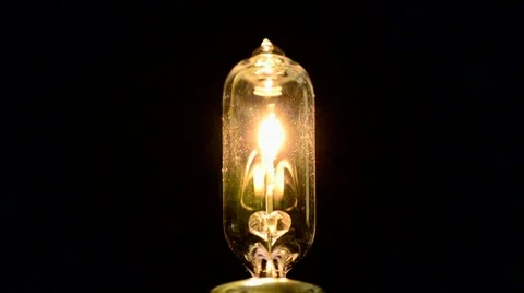 Tungsten light bulb switching on &amp; off Stock Footage 10573030