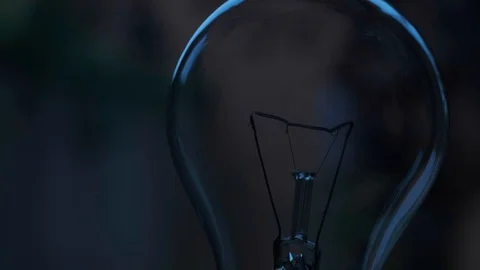 A tungsten light bulb turns on Video stock 129238063