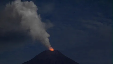 Tungurahua volcano blast by night volcanoe volcano tour dust erupting lava rock Stock Footage