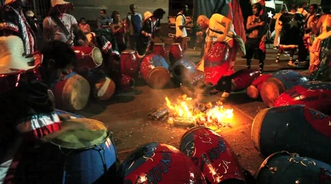 Tuning Candombe Drums by Fire Stock Footage 4886025