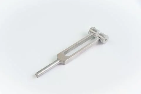 A tuning fork on white background. Stock Photos