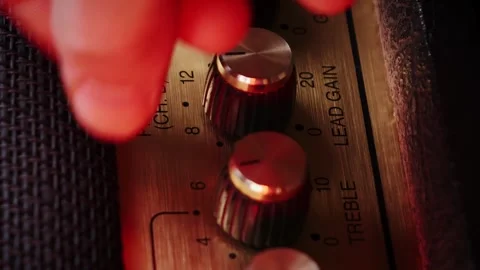 Tuning guitar amplifier tone equalizer knobs. Vertical video. Music concept 스톡 동영상 241338666