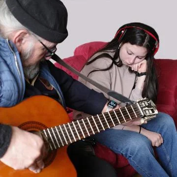 Tuning a guitar Stock Photos