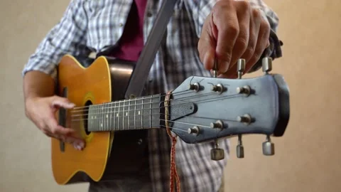 Tuning Guitar Strings 4K Stock Footage 166059839