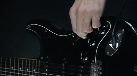 Tuning guitar volume Stock-Footage 45357168
