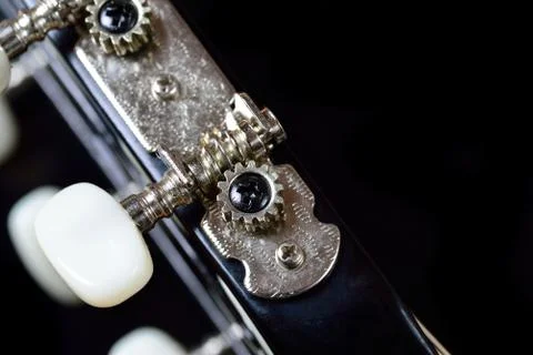 Tuning machine head and peg of an acoustic guitar Stock Photos