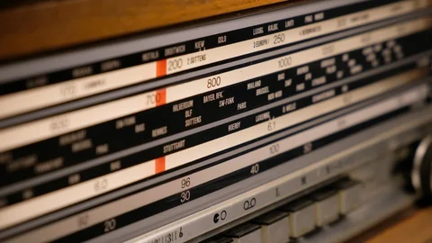 Tuning an old vintage analogic wooden radio dial. Close-up. Stock Footage