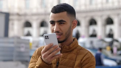 Tunisian man using phone vocal assistant and sending vocal message Stock Footage 218584046