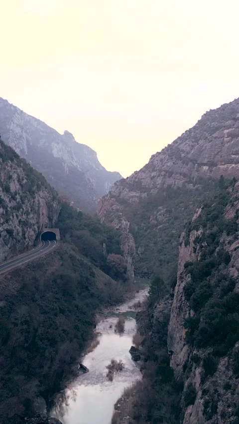 A tunnel along a river between mountains Video stock 272166221