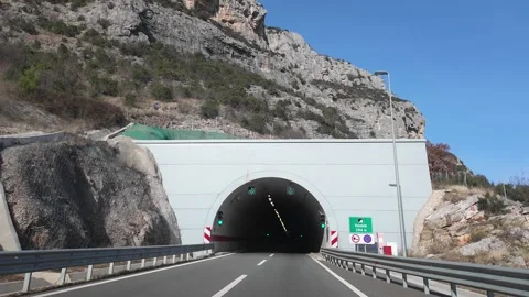 Tunnel between mountains road time laps. Stock Footage 317628502