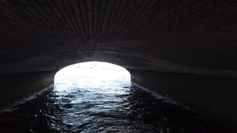 Tunnel, bridge over the river. Brickwork of an old low bridge. Video stock 162232194