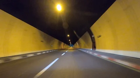 Tunnel Driving : Car driving through a road tunnel. Stock Footage
