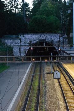 Tunnel entry exit it the evening with lights blue hour Stock Photos