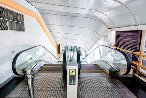 Tunnel escalator scroll down Stock Photos