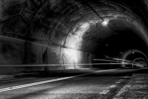Tunnel at night with rays of light Stock Photos