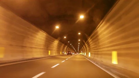 Tunnel view, move out from tunnel, on the highway in  mountains, Europe, France Stock Footage 73377261