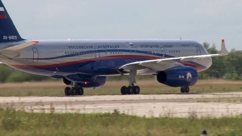 Tupolev Tu-204 medium-range passenger aircraft taxis on runway after landing. Stock Footage 115696056