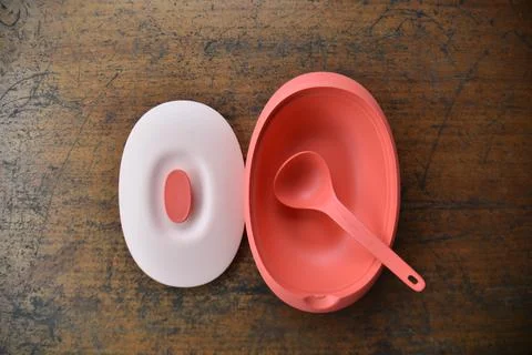 Tupperware serving set with wood table background Stock Photos