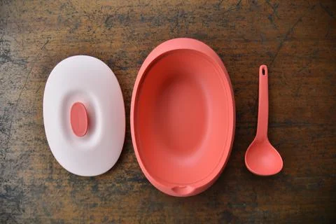 Tupperware serving set with wood table background Stock Photos