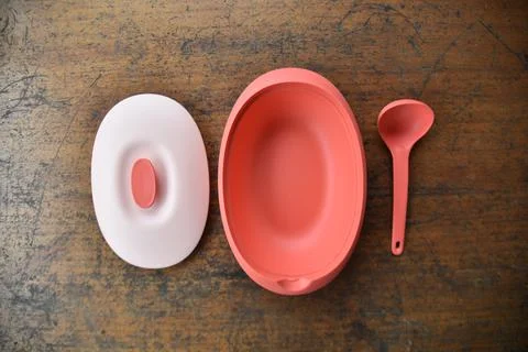 Tupperware serving set with wood table background Stock Photos