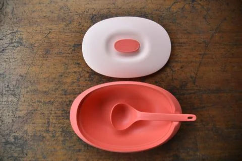 Tupperware serving set with wood table background Stock Photos