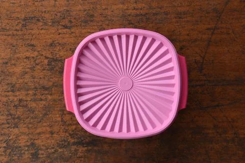 Tupperware serving set with wood table background Stock Photos