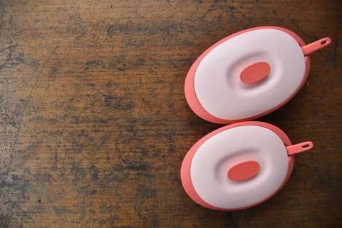 Tupperware serving set with wood table background Stock Photos