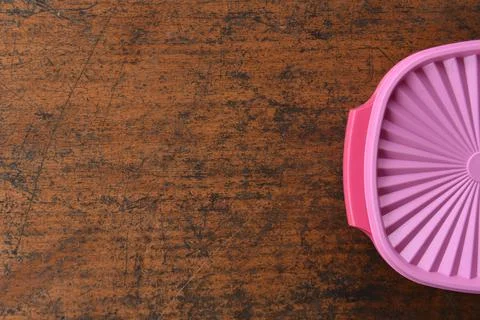 Tupperware serving set with wood table background Stock Photos