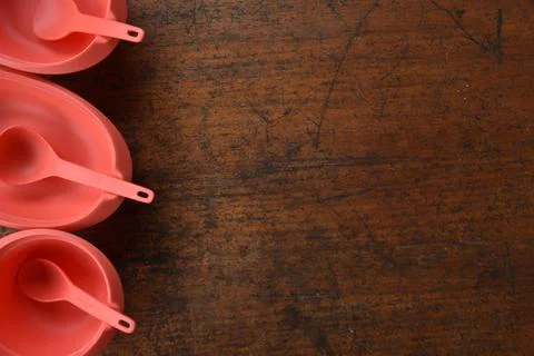 Tupperware serving set with wood table background Stock Photos