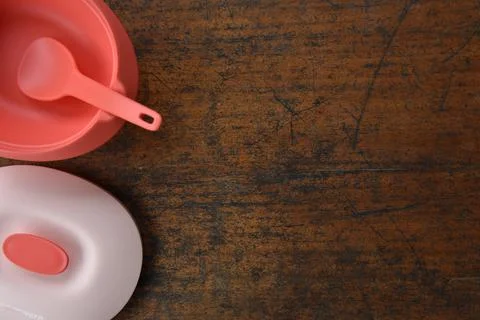Tupperware serving set with wood table background Stock Photos