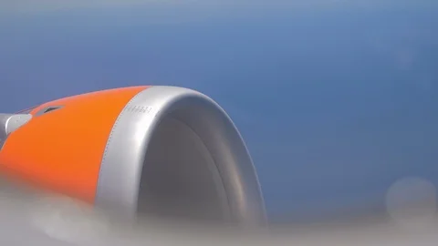 Turbine Engine during a flight. Passenger POV from a window Aircraft. Sky Stock Footage 119865538