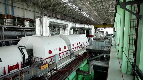 A turbine generator in the engine room of a nuclear power plant. HD Stock Footage